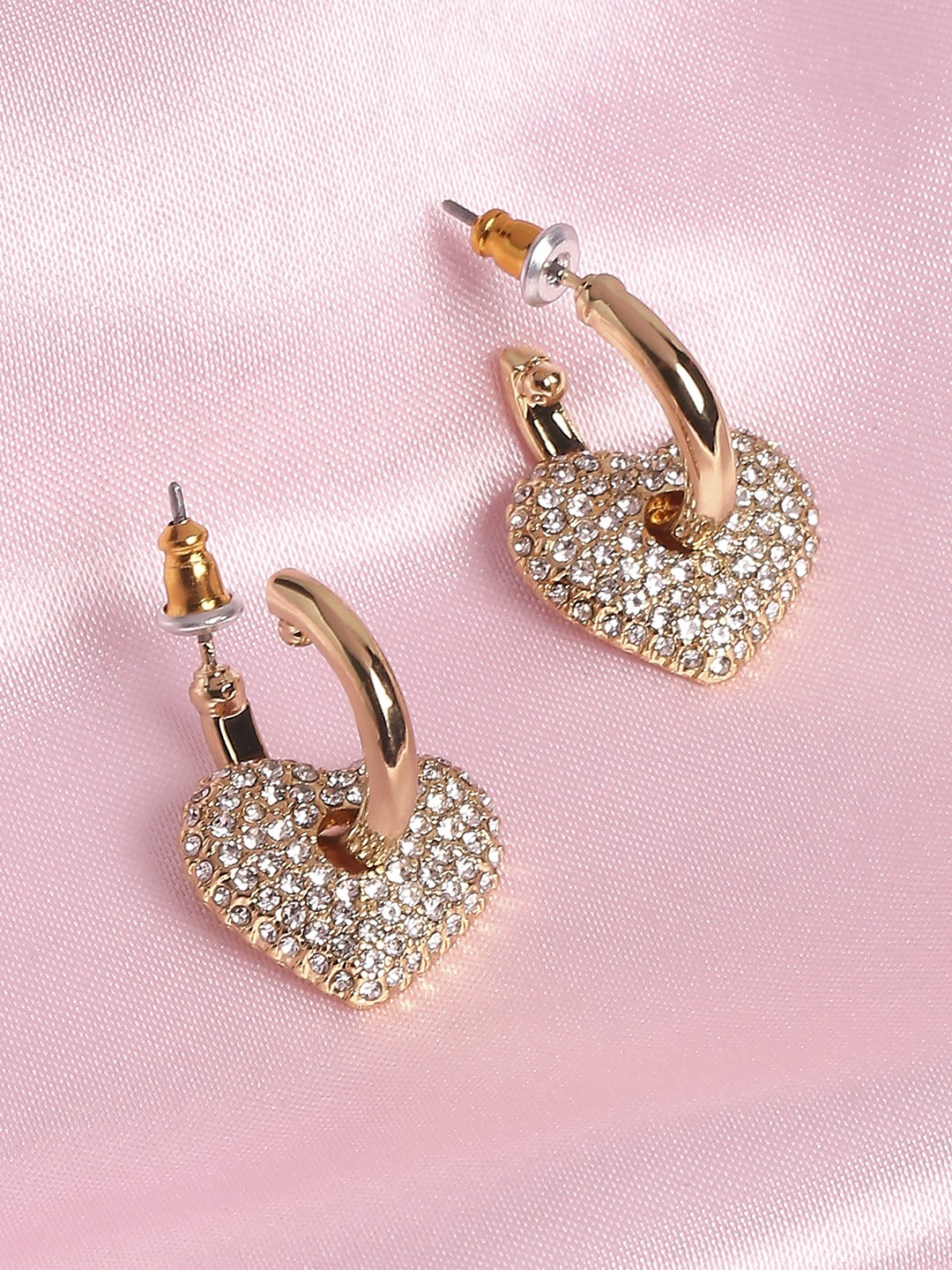Gold toned hoop earrings with crystal studded heart charm