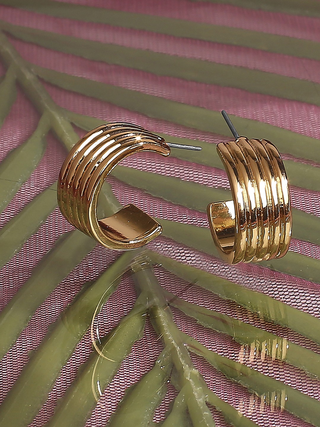 Gold toned multi layered half hoop earrings