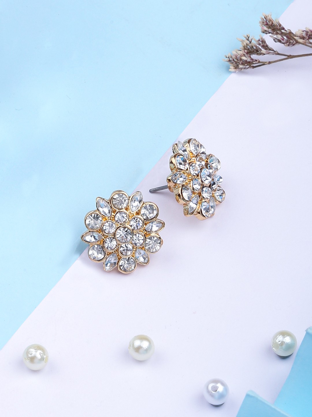 Gold toned statement stud earrings with crystals