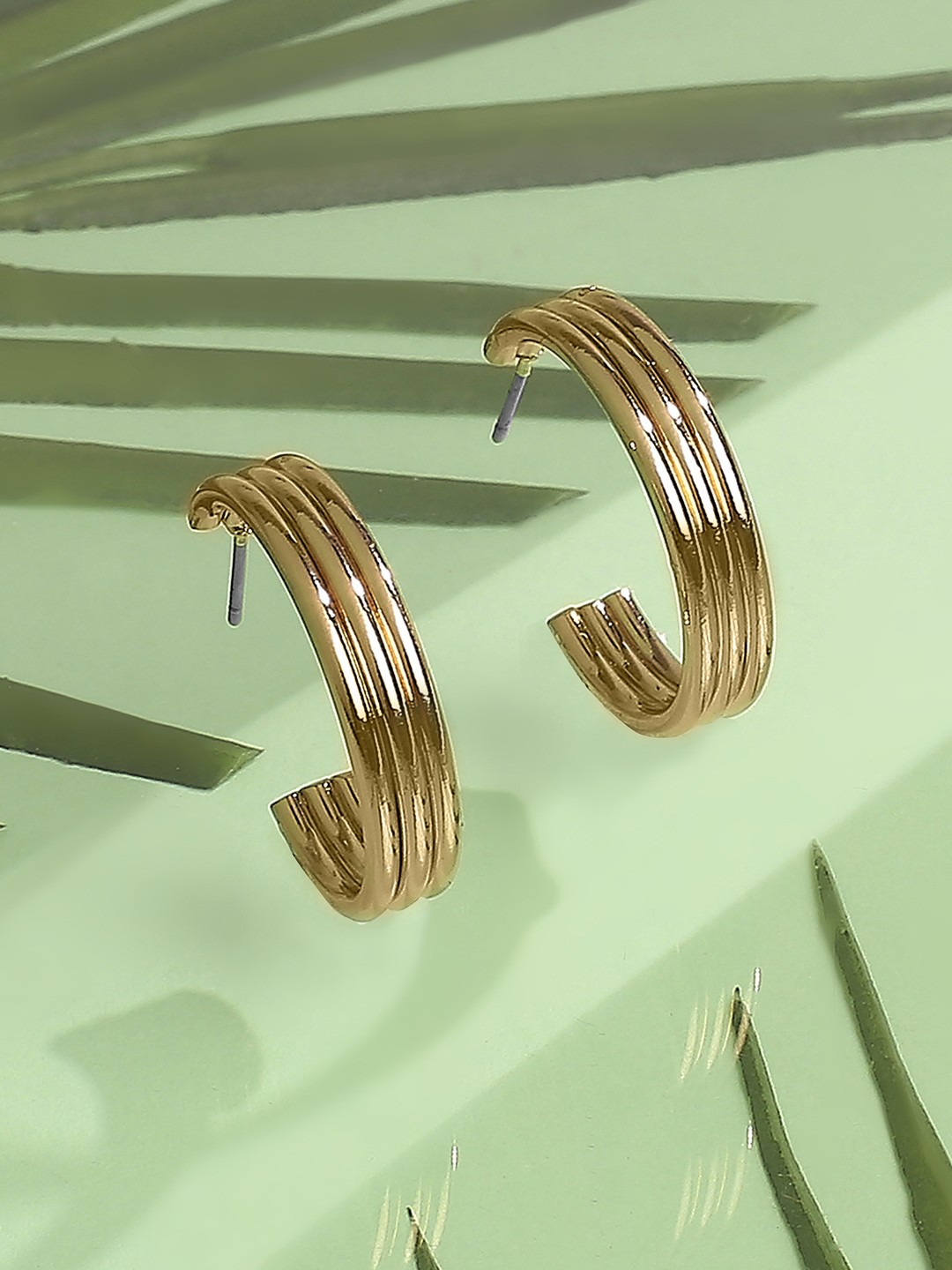 Gold toned triple half hoop earrings