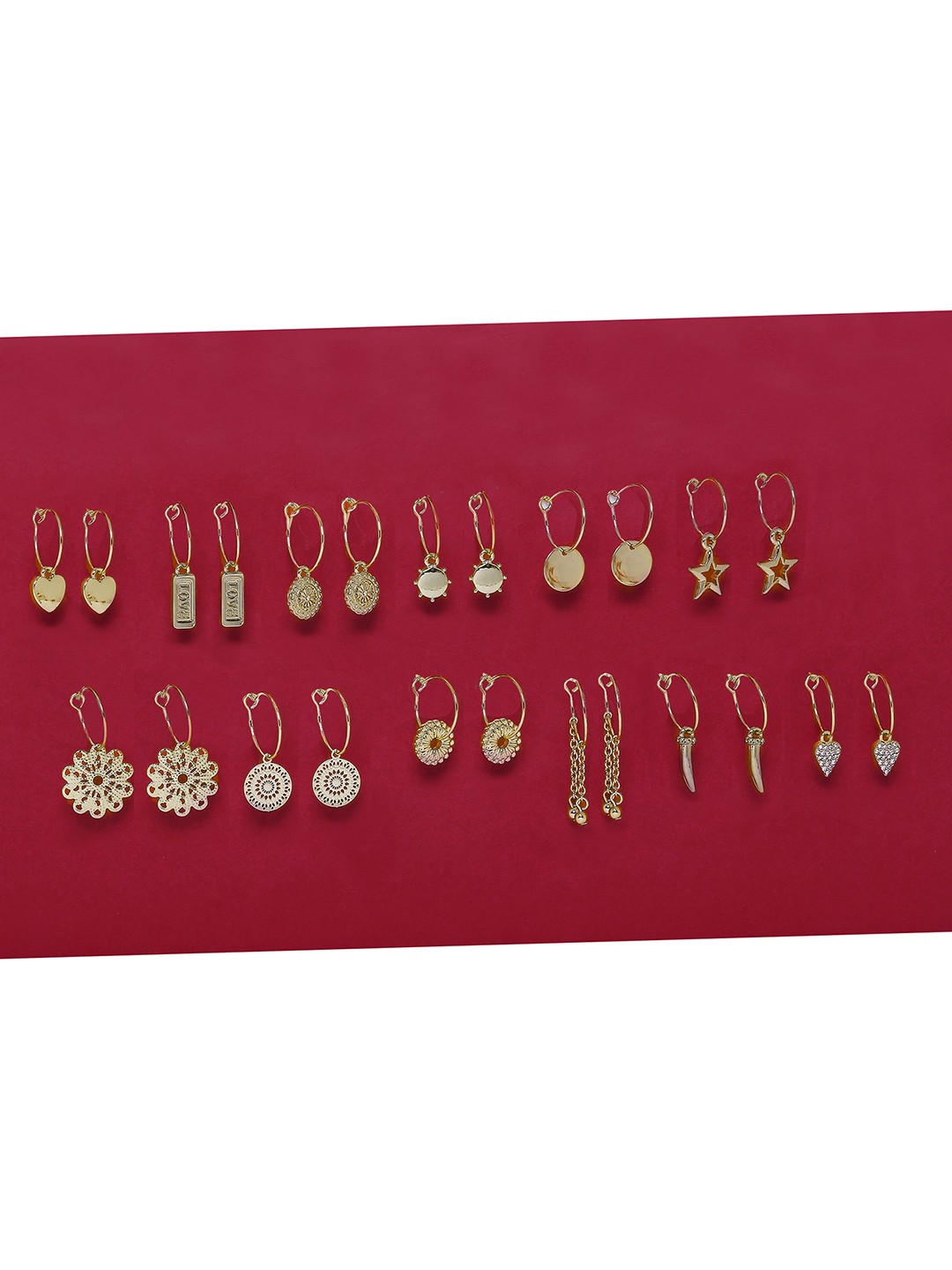 Gold plated Set of 12 Bali earrings with charms