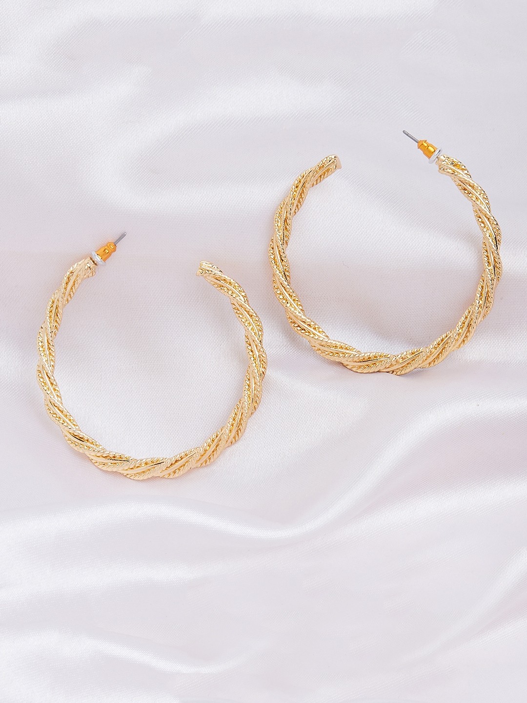 Gold toned twisted hoop earrings
