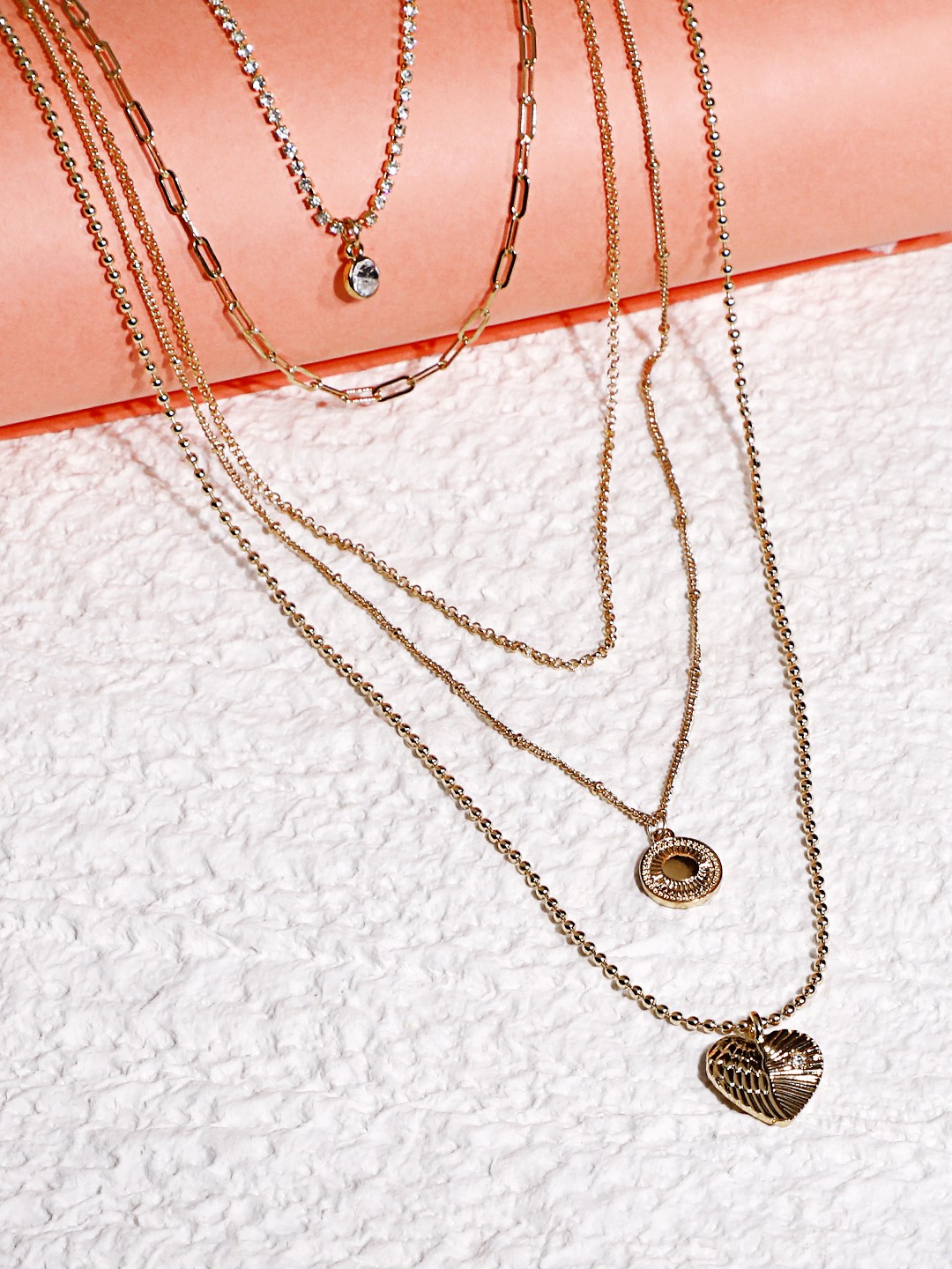 Gold toned 5 layered necklace with heart, coin pendant and crystal chain