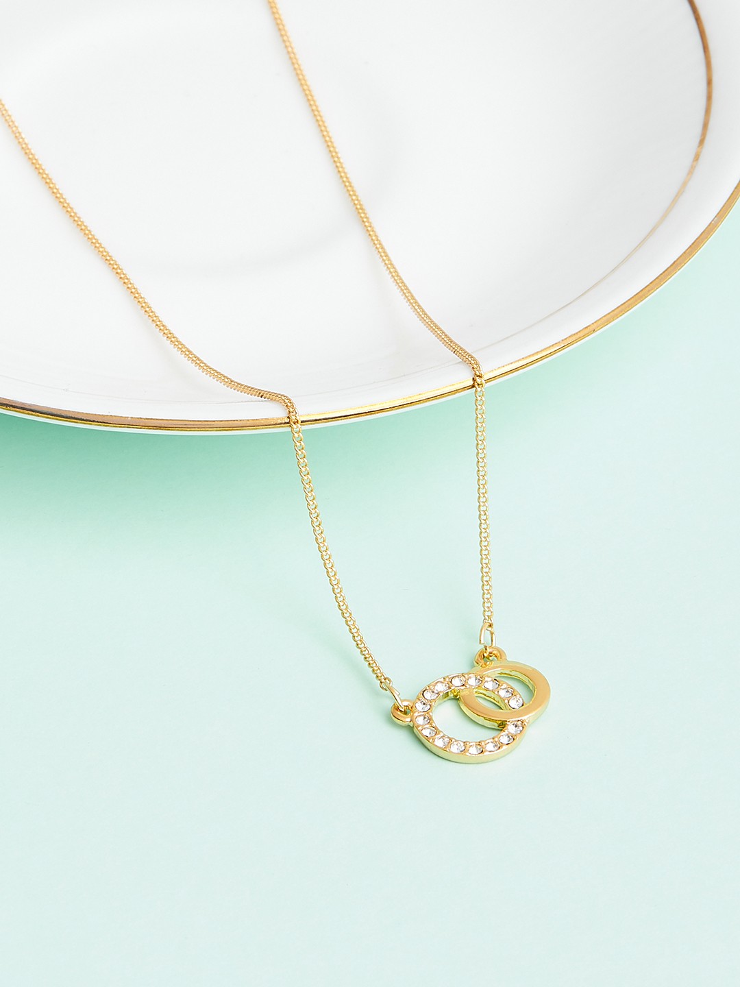 Gold toned chain with crystal Interlinked ring pendant