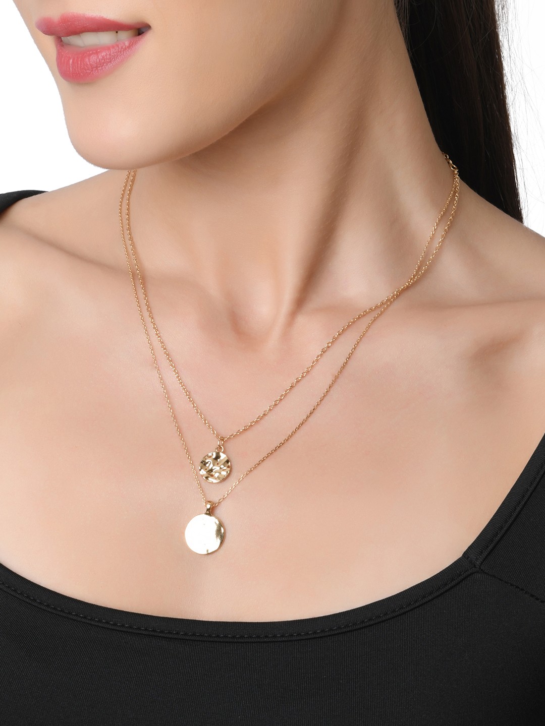 Gold toned two layered necklace with hammered coin charm