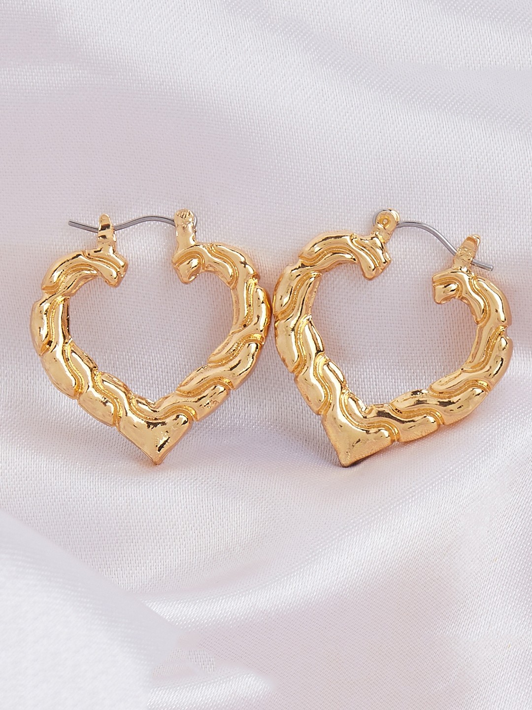 Gold toned heart shape hoop earrings