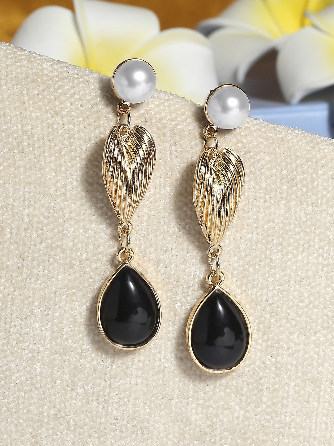 Gold toned pearl and black drop dangler earrings