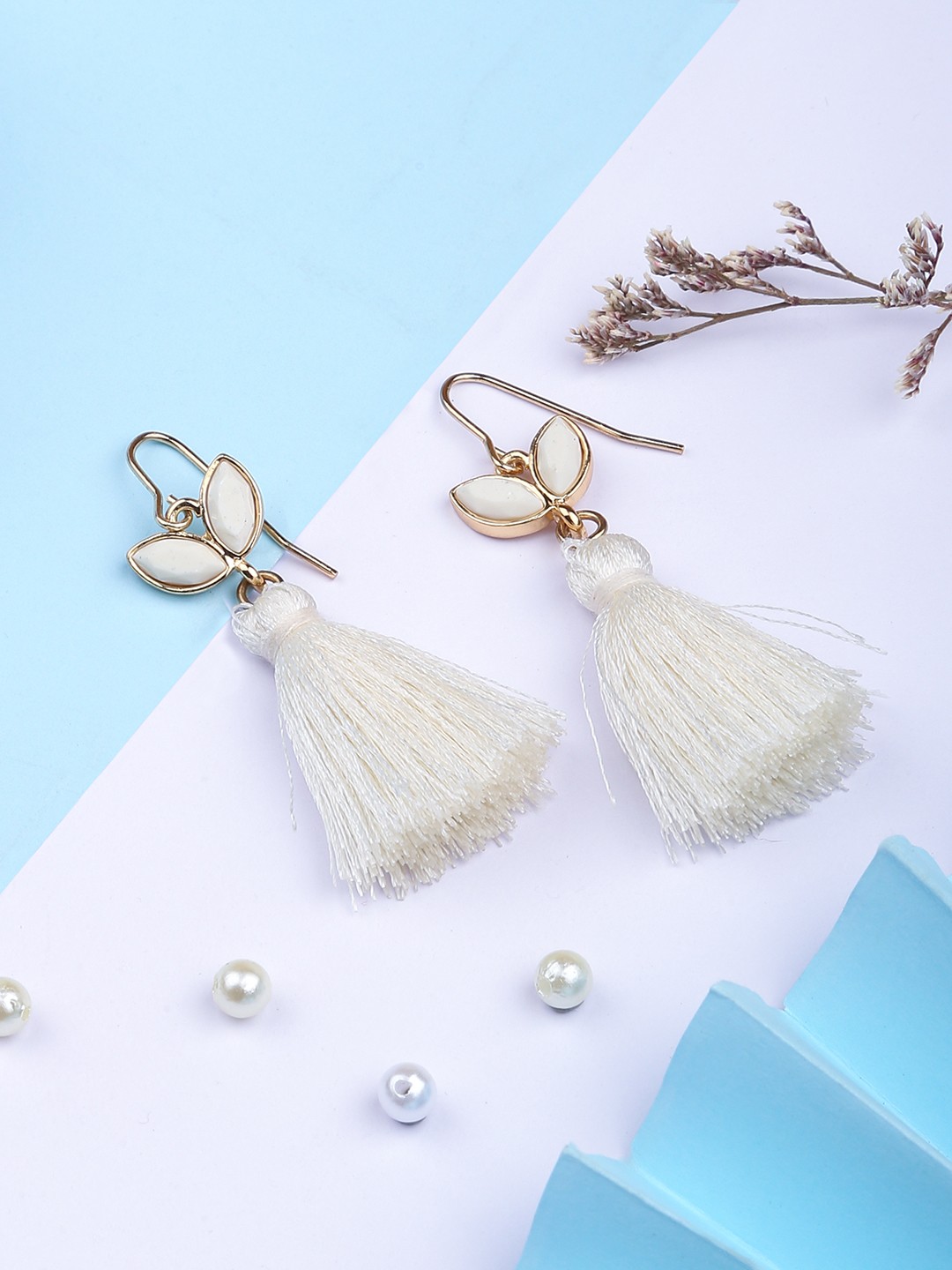 Gold tonned white tassel dangler earring