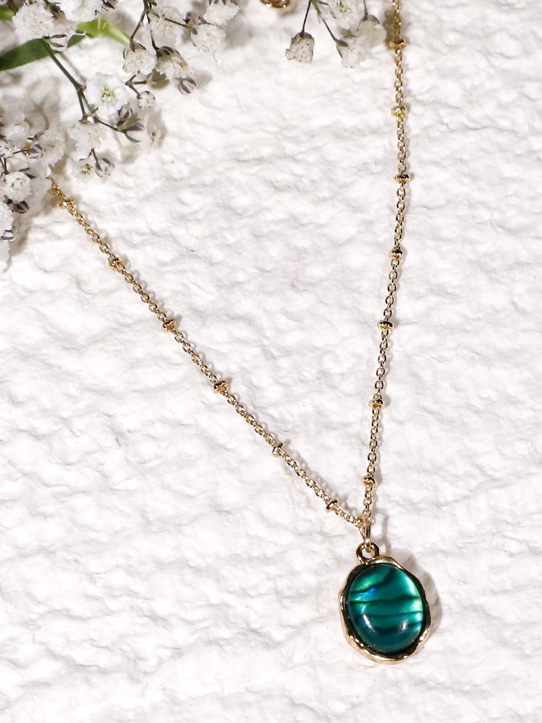 Gold plated oval pendant necklace with green marble stone