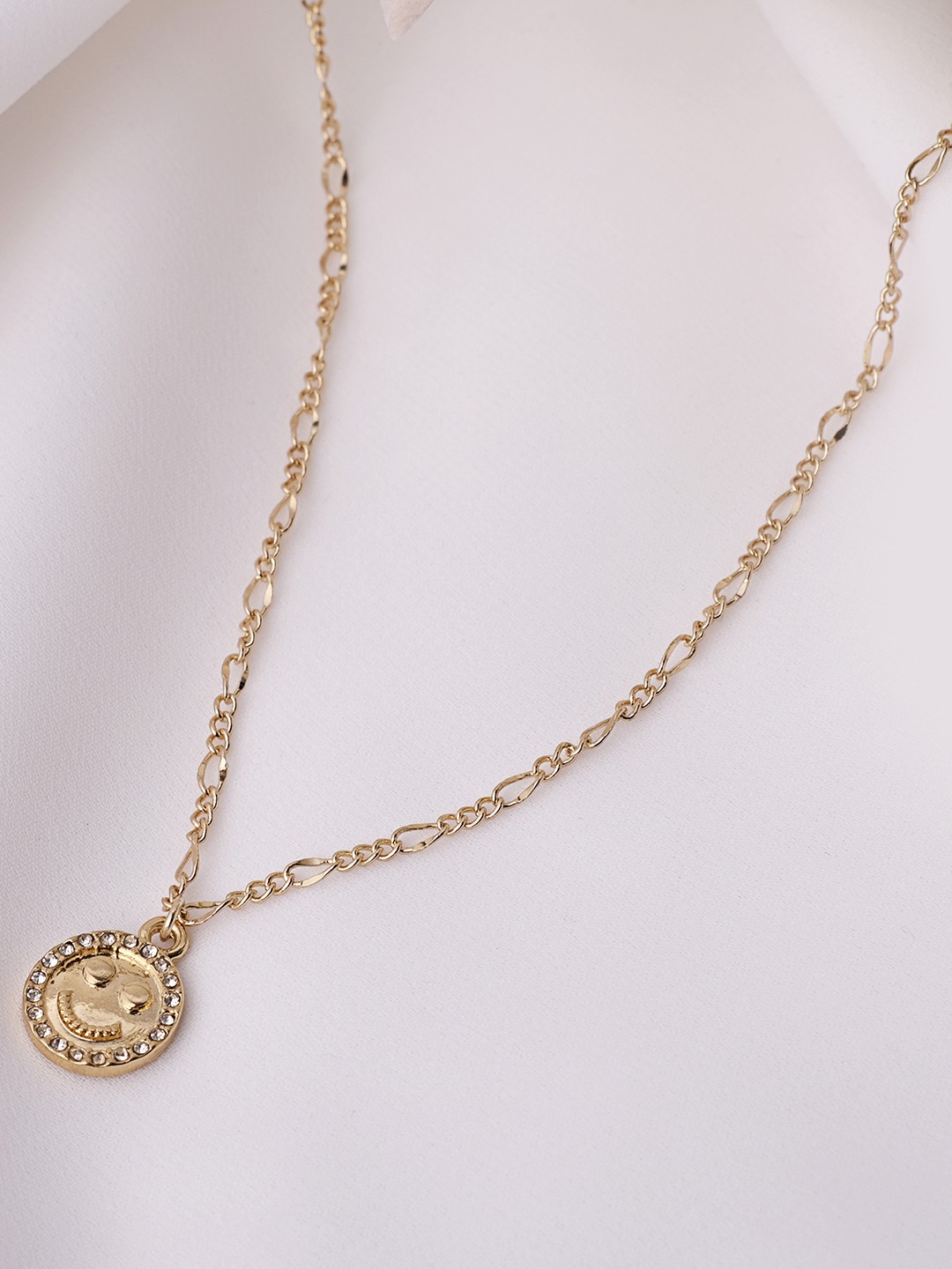 Gold tonned necklace with stone stud smiley pendant