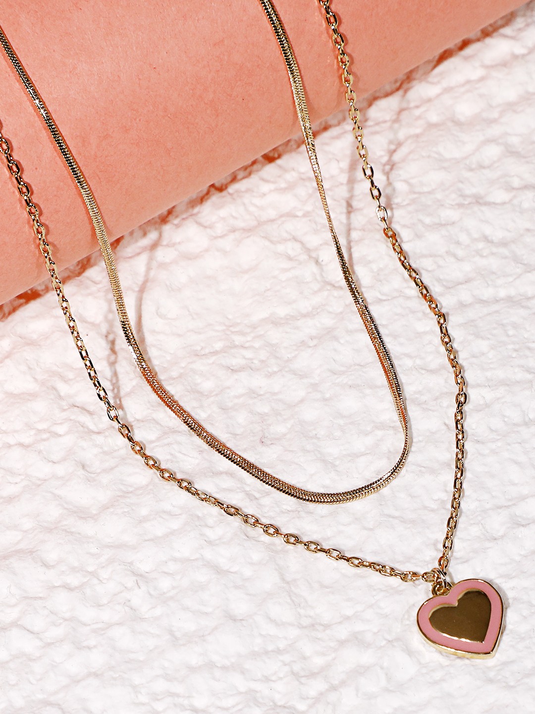 Gold toned set of 2 layered necklace with pink enameled heart pendant