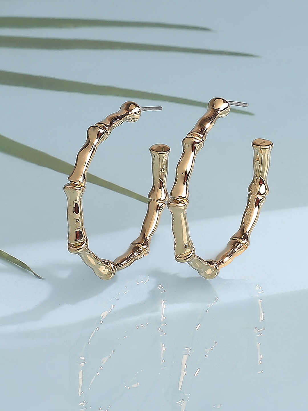 Gold toned bamboo hoop earrings