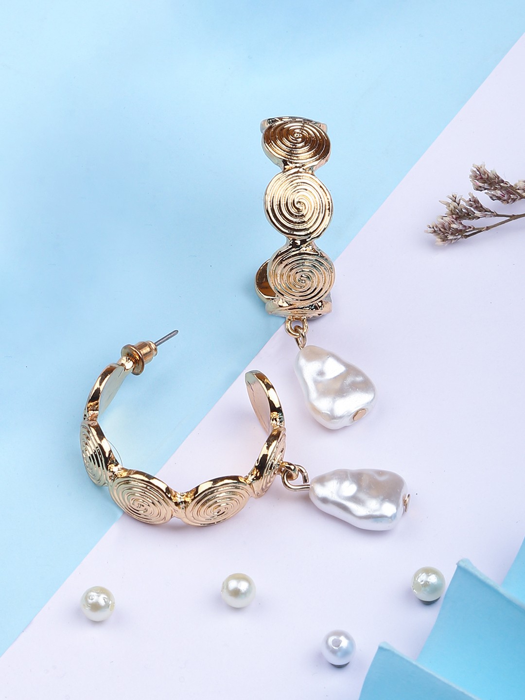 Gold toned textured hoop earrings with drop pearl