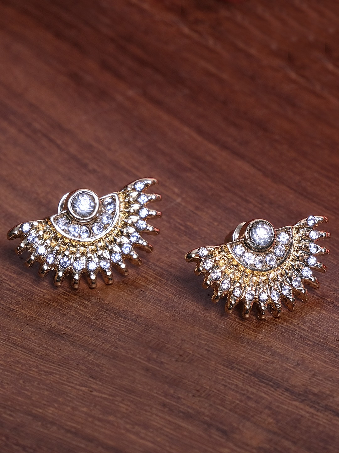 Gold toned crystal studed half circular stud earrings