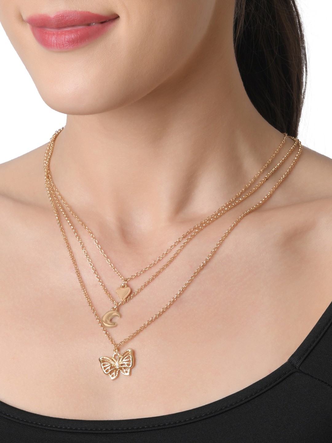 Gold toned three layered necklace with butterfly heart and moon charm