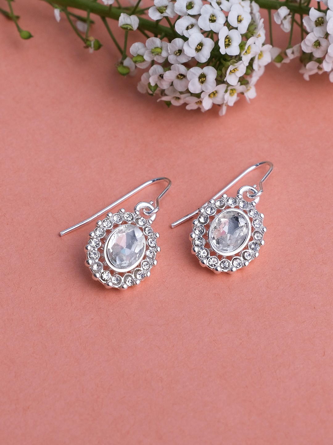 Silver toned crystal studed round shaped dangler earrings