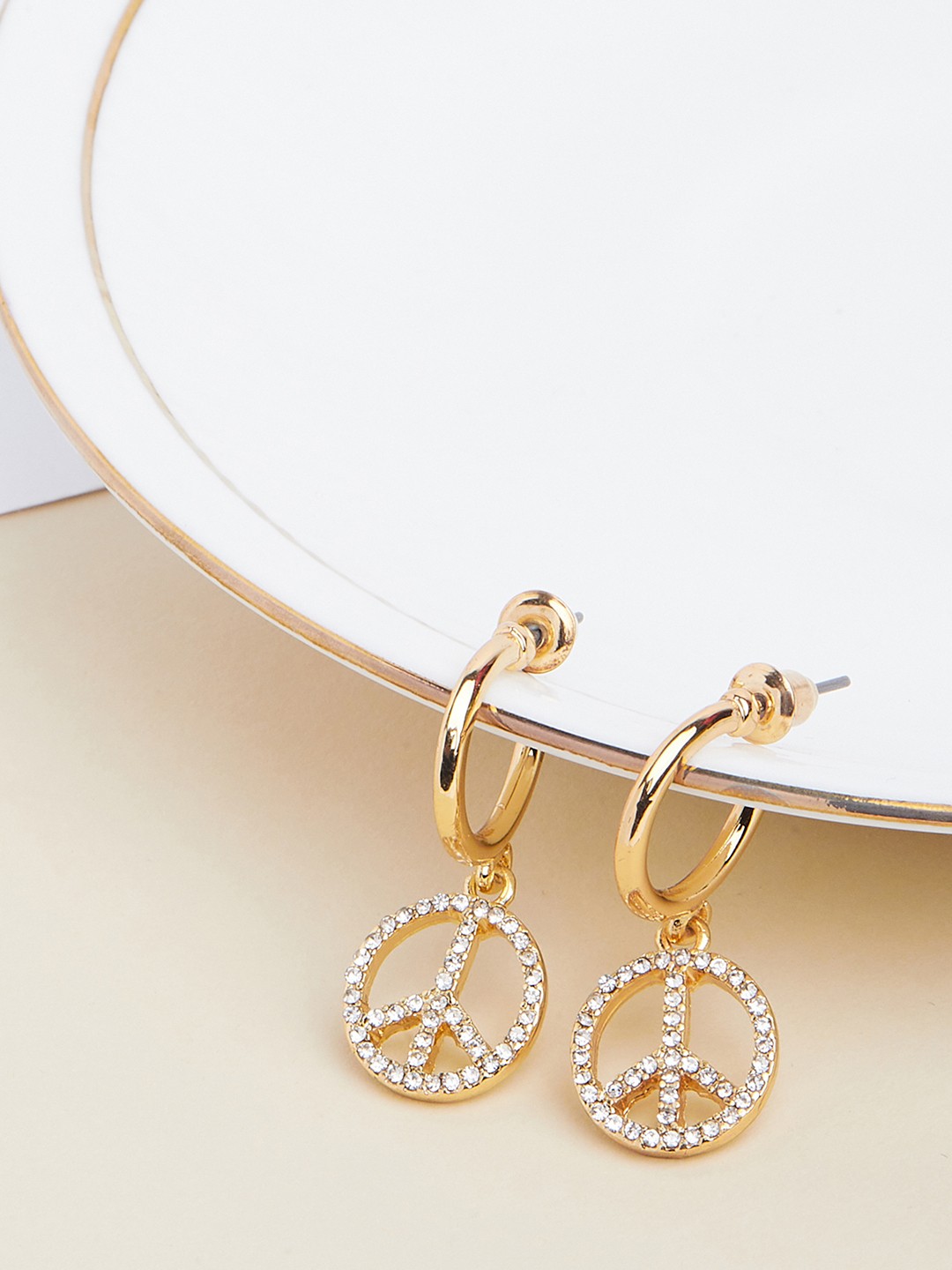 Gold plated hoop earring with peace charm