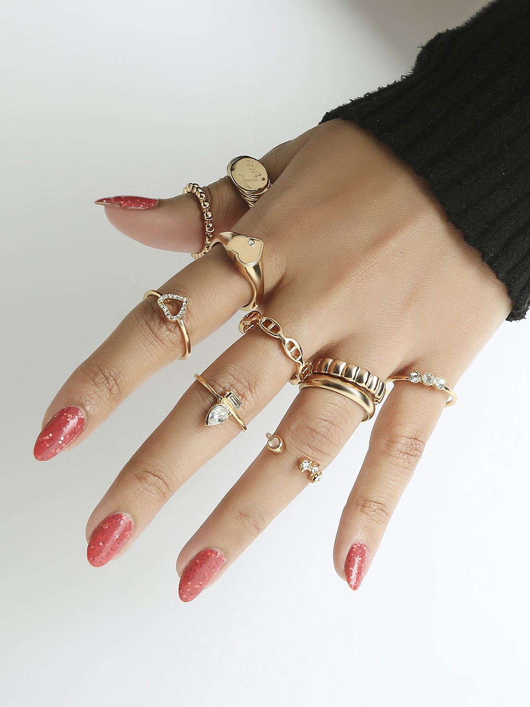 Set of 10 crystal studded contemporary gold toned rings