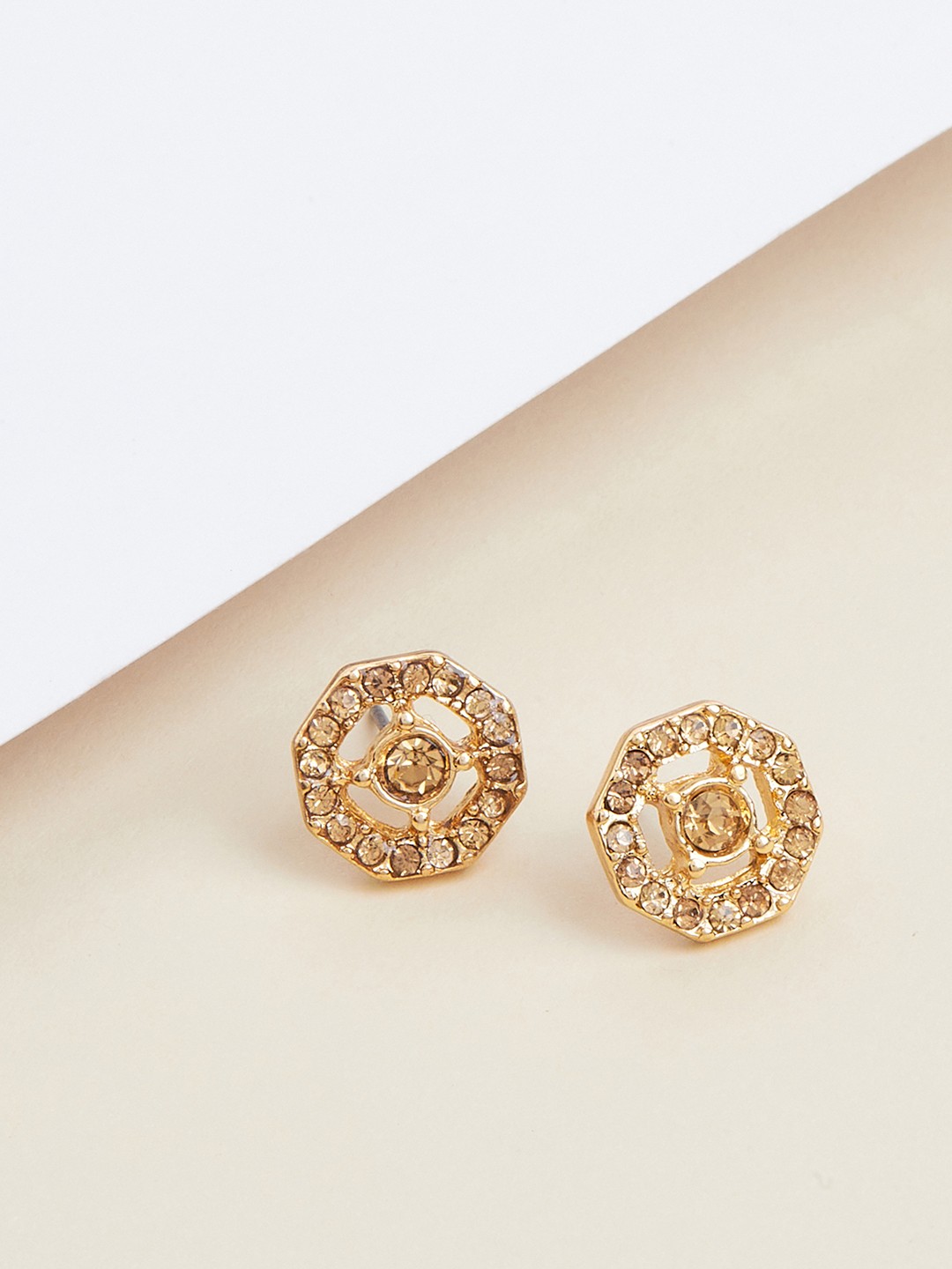 Gold toned hexagon shaped stud earrings